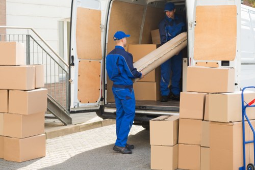 Removal van and moving boxes in a Harmondsworth residential street