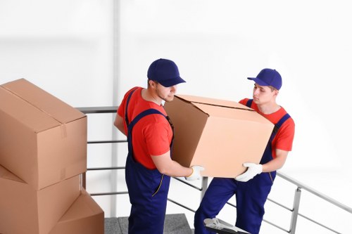 Moving van and packed boxes ready for a house removal in Harmondsworth