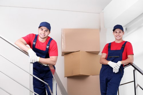 Moving team protecting furniture during a Harmondsworth van job