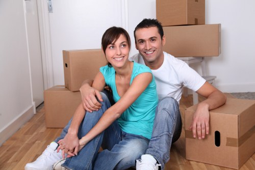 Removal team handling furniture during a local move near Harmondsworth