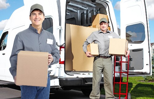 Packing boxes and household items for transport in Harmondsworth